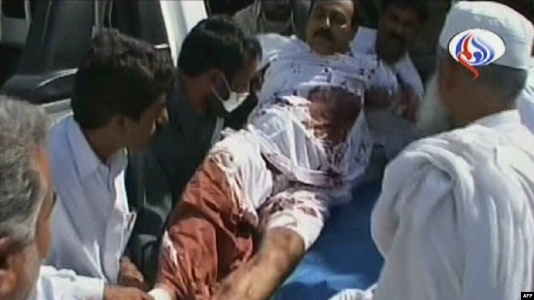 Iran's official Arabic-language Al-Alam TV shows a wounded man arriving at a hospital in the southeastern Iranian city of Pishin, near the border with Pakistan, on October 18.