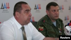 The head of the self-proclaimed Donetsk People's Republic, Aleksandr Zakharchenko, (right) and his Luhansk counterpart, Igor Plotnitsky, attend a press conference in Donetsk in July.