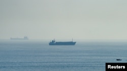 Vessels in the Strait of Hormuz, as seen from Musandam, Oman, July 31, 2026.