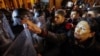 Georgian President Salome Zurabishvili confronts riot police at a pro-EU rally in Tbilisi on November 28.