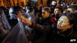 Georgian President Salome Zurabishvili confronts riot police at a pro-EU rally in Tbilisi on November 28.