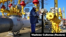 An employee works at a gas distribution plant in Moldova. (file photo)