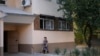 A local resident walks outside the apartment block in Tashkent where Sayfullo Saipov, the suspect in the New York terror attack, reportedly lived between 1996 and 2006, according to police records.