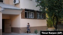 A local resident walks outside the apartment block in Tashkent where Sayfullo Saipov, the suspect in the New York terror attack, reportedly lived between 1996 and 2006, according to police records.