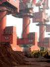Soil containing various rare-earth elements waits to be loaded on to a ship at a port in Lianyungang, China. (File photo)