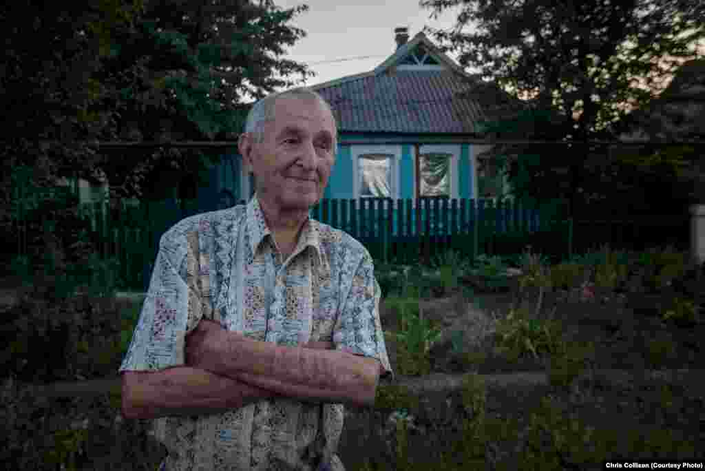 Nikolai Ivanovich, an 86-year-old pensioner, stands outside his home in the town of Myrnohrad. He said his pension was not enough, and prices were on the rise. &ldquo;I had to sell my car because my pension was too low. That&rsquo;s how we live now.&rdquo;&nbsp;