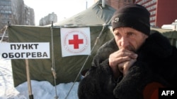  A homeless man stands outside a temporary shelter in the Ukrainian city of Donetsk