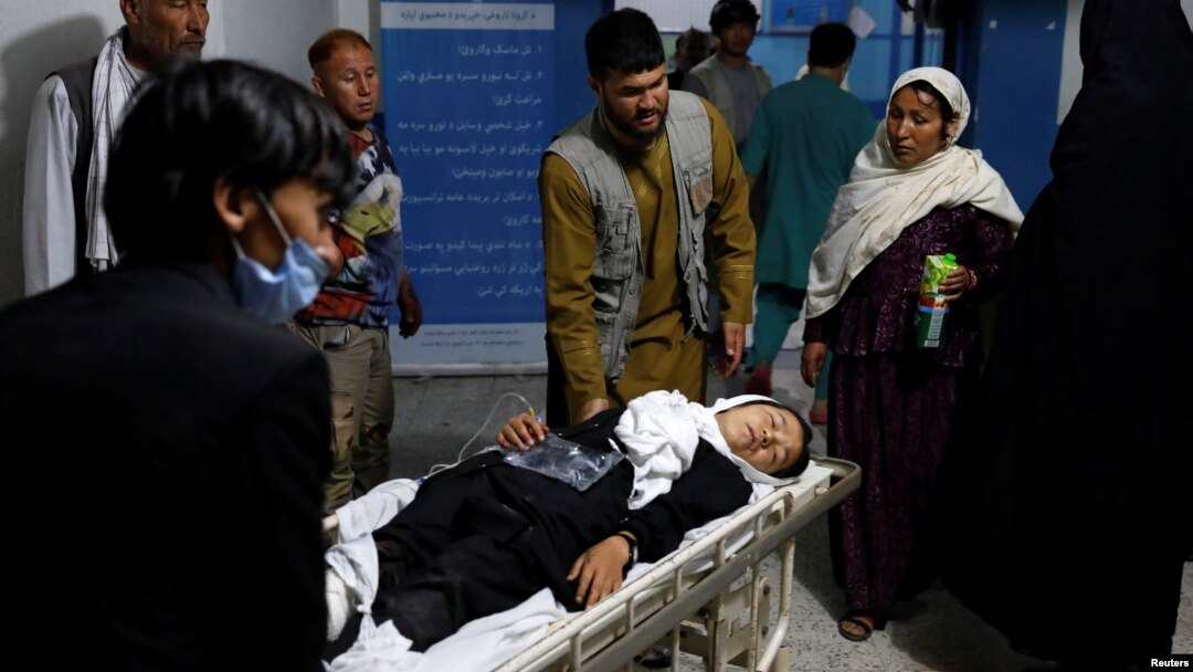 An injured schoolgirl is transported to a hospital after the blast in Kabul.