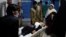 An injured schoolgirl is transported to a hospital after the blast in Kabul.
