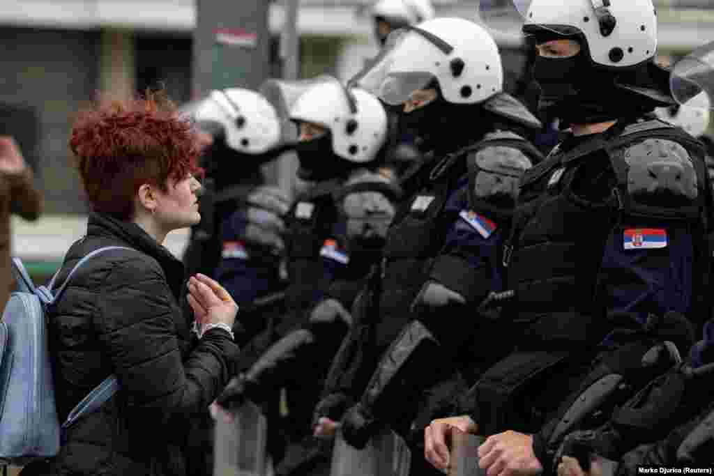 Serbian police officers stand guard at the Old Sava Bridge in Belgrade during a protest against plans to demolish the structure.&nbsp;