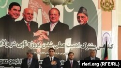 Officials from Turkmenistan, Afghanistan, Pakistan, and India meet at a TAPI project meeting in Herat, Afghanistan, in April, posing in front of a poster of the leaders of their countries. 