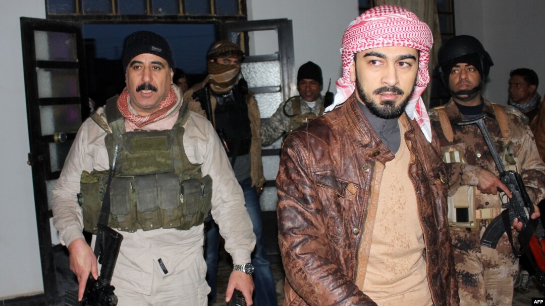 Tribal militia commander Muhammad Khamis Abu Risha (right) says only about 10 percent of Ramadi is still controlled by the insurgents.