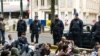 Afghan asylum seekers block a road in Brussels after being evicted from their shelter by Belgian police on June 16.