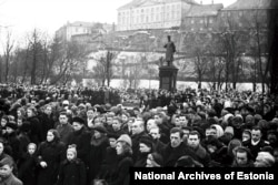 Crowds gather around a statue to Stalin after his death was announced in March 1953. The monument, which stood at the entrance to Tallin’s old town, is now kept in an outdoor museum with other communist-era statues.