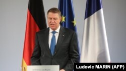 Romanian President Klaus Iohannis has called on the government to reveres a series of judicial reforms criticized by the U.S. and EU.
