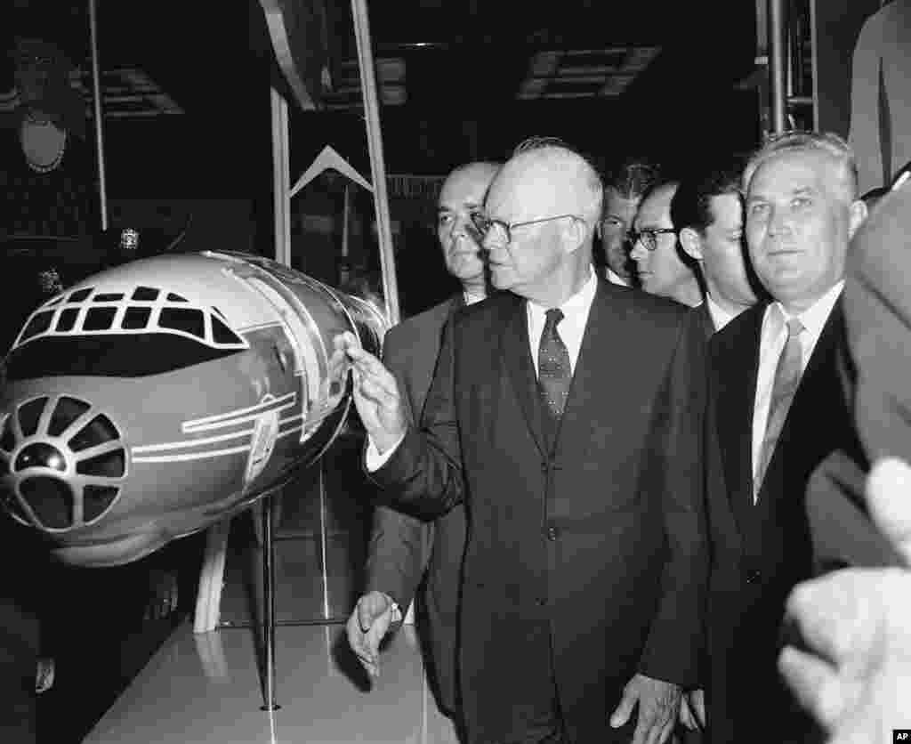 U.S. President Dwight D. Eisenhower inspects a model of the TU-114 aircraft that had transported a Soviet delegation from Moscow for the event. &nbsp;