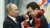 Russian President Vladimir Putin awards a medal to singer Iosif Kobzon (right) during a ceremony in the Kremlin in Moscow in August 2012. 