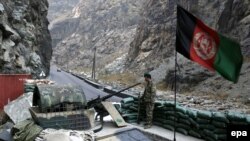 A member of the Afghan security force stands guard on a roadside near Kabul (file photo).