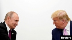  US President Donald Trump (right) and Russian President Vladimir Putin (file photo)