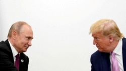 FILE PHOTO: U.S. President Donald Trump and Russian President Vladimir Putin at the G20 leaders summit in Osaka, Japan, in 2019.