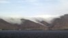 Armenia - Clouds coming down on the eastern coast of Lake Sevan.