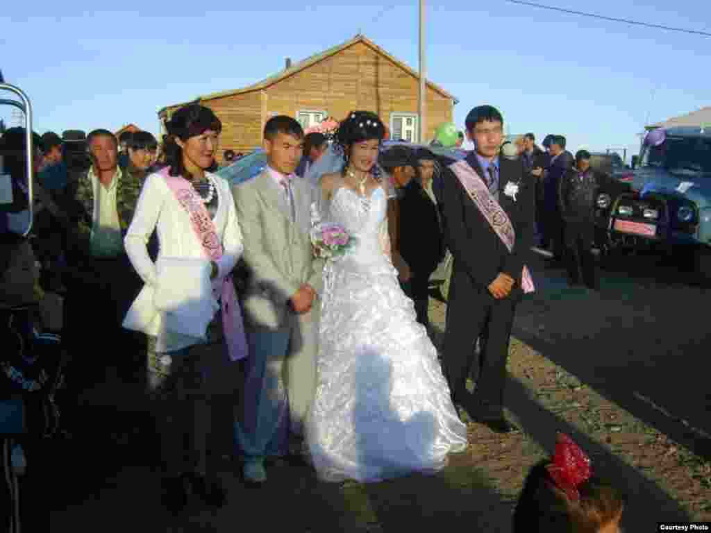 After the traditional wedding ceremony, the couple changes into Western dress as the celebration continues.