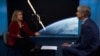 Former US Space Force commander DeAnna Burt talking to RFE/RL's Ray Furlong