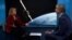 Former US Space Force commander DeAnna Burt talking to RFE/RL's Ray Furlong