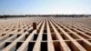 Empty prepared graves at Tehran's Behesht Zahra cemetery. The head of the city council says the capacity of the cemetery has been tripled.