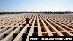 Empty prepared graves at Tehran's Behesht Zahra cemetery. The head of the city council says the capacity of the cemetery has been tripled.