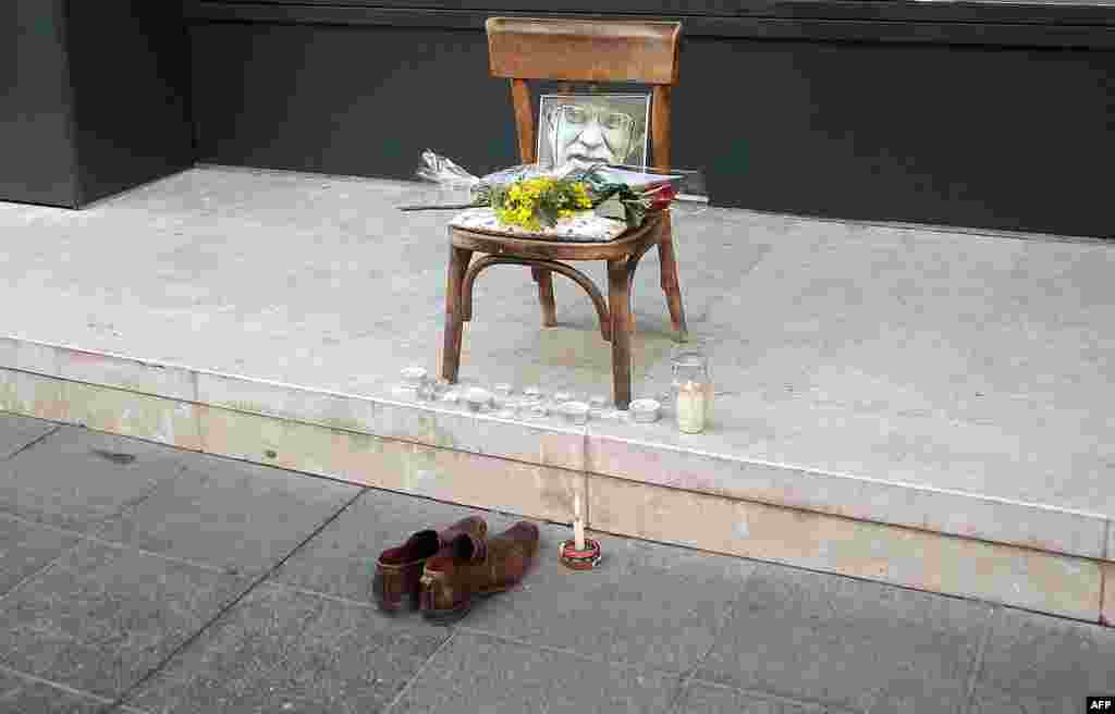 A makeshift memorial with a picture of legendary shoe cleaner &quot;Uncle&quot; Miso is seen on a main street in Sarajevo. (AFP/Elvis Barukcic)