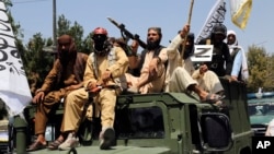 Taliban fighters celebrated the third anniversary of the withdrawal of U.S.-led troops from Afghanistan in Kabul on August 14.