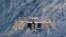 Снимок NASA показывает крупным планом  Международную космическую станцию. Фото от 7 марта 2011 сделано с борта корабля Дискавери