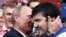 Russian President Vladimir Putin (left) congratulates Russia's Tagir Khaibulayev after he defeated Mongolia's Tuvshinbayar Naidan in their men's 100-kilogram final judo match at the London 2012 Olympic Games. 