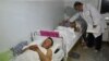 A doctor attends to wounded soldiers in a hospital in the southwestern Kyrgyz town of Batken on May 3.