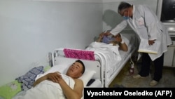 A doctor attends to wounded soldiers in a hospital in the southwestern Kyrgyz town of Batken on May 3.