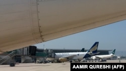 FILE: Planes sit on the tarmac at the Islamabad International Airport.