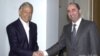 U.S.-Armenian billionaire Kirk Kerkorian (left) meets then-Armenian President Robert Kocharian in Yerevan in 1998. 