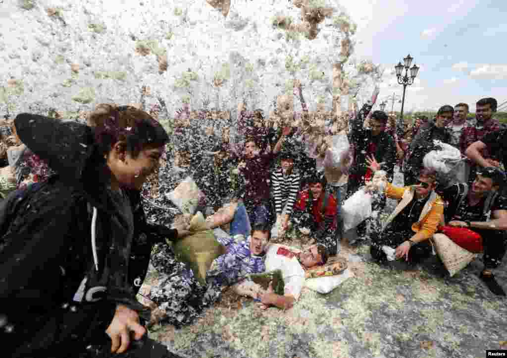 People take part in a pillow fight during a flash mob in Kyiv, Ukraine. (Reuters/Valentyn Ogirenko)