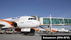 FILE: An Afghan Kam Air passenger jet is parked at Kabul International Airport.