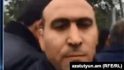 Armenia -- A plainclothes man attacks RFE/RL's Arus Hakobian in Artashat, 21Apr2018.