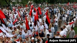 Hundreds of supporters of Pakistani opposition parties take part in a rally in Islamabad on August 8.