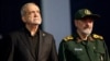 Iranian President Masud Pezeshkian (left) and Mohsen Rezaei, an adviser to Iran's supreme leader, attend a farewell ceremony for Iran's late Supreme Leader Ayatollah Ali Khamenei, in Tehran, July 3.