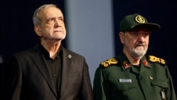 Iranian President Masud Pezeshkian (left) and Mohsen Rezaei, an adviser to Iran's supreme leader, attend a farewell ceremony for Iran's late Supreme Leader Ayatollah Ali Khamenei, in Tehran, July 3.