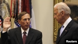 U.S. Vice President Joe Biden (right) swears-in David Petraeus as the new CIA chief at the White House in Washington, DC. 