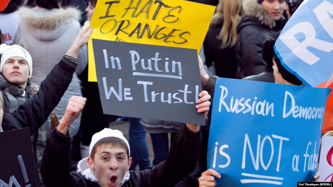 Pro-Kremlin demonstrators rally on Manezh Square in Moscow on December 12.
