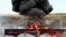 Iranian police burning seized drugs in July