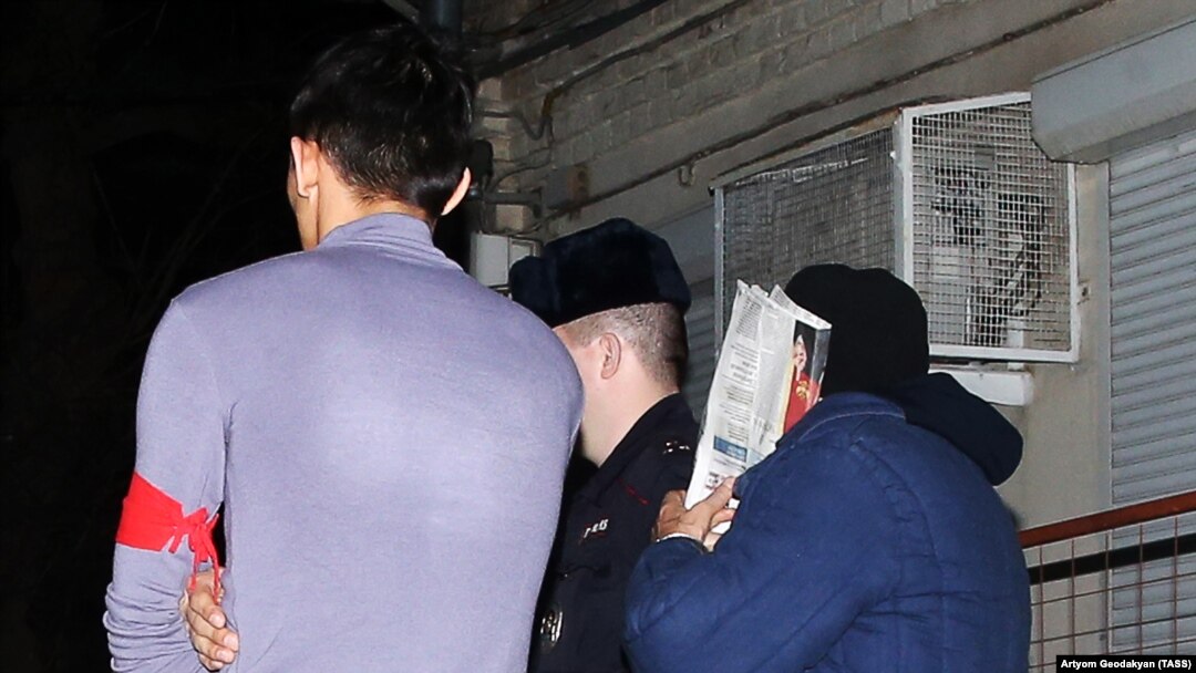 Gennady Lopyrev (right) is seen after a hearing outside the 94th Garrison Military Court in January 2017.