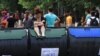 Armenia - A protester sits on a trash container forming part of a barricade on Marshal Bagramian Avenue, Yerevan, 25Jun2015.