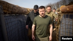 Ukrainian President Volodymyr Zelenskiy inspects new fortifications in the Kharkiv region on April 9.